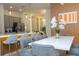 Open concept: dining and kitchen, featuring barstool seating and modern appliances at 10443 Ebb Tide Ln, Orlando, FL 32821
