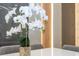 Close-up of a dining table adorned with a beautiful floral centerpiece and modern accents at 10443 Ebb Tide Ln, Orlando, FL 32821