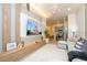 Open concept living space with comfortable seating, modern design, and a view of the kitchen and dining area at 10443 Ebb Tide Ln, Orlando, FL 32821