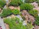 Aerial view of a lakeside community with mature trees and on-site parking at 1068 E Michigan St # A, Orlando, FL 32806