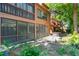The property features mature trees, a screened-in patio and a private backyard at 1068 E Michigan St # A, Orlando, FL 32806