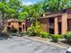 A lush landscaped condo community showing well-maintained buildings, landscaping and ample parking at 1068 E Michigan St # A, Orlando, FL 32806