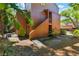 An exterior view showcasing the home's design surrounded by lush tropical landscaping at 1068 E Michigan St # A, Orlando, FL 32806
