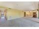 Spacious living room featuring neutral carpeting, fireplace, and ample natural light at 1068 E Michigan St # A, Orlando, FL 32806