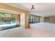 Bright living room featuring sliding glass doors to a patio, and neutral carpeting at 1068 E Michigan St # A, Orlando, FL 32806