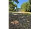 Large backyard with mature trees surrounding the property providing shade and privacy at 1121 Santa Anita St, Orlando, FL 32808