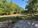 Spacious backyard featuring a brick-paved area, ready for customization and outdoor enjoyment at 1121 Santa Anita St, Orlando, FL 32808