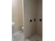 Clean bathroom featuring tiled shower stall, pedestal sink, and toilet at 1121 Santa Anita St, Orlando, FL 32808