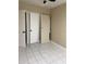Bedroom with tile flooring, closet, and neutral paint, ready for customization at 1121 Santa Anita St, Orlando, FL 32808