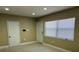 Spacious living room with tile flooring, recessed lights and natural light from a large window at 1121 Santa Anita St, Orlando, FL 32808