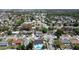 Aerial view of a neighborhood featuring tree-lined streets and various roof styles at 11364 Cardiff Dr, Orlando, FL 32837