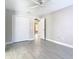 Neutral bedroom with ceiling fan, closet, and views into a hallway at 11364 Cardiff Dr, Orlando, FL 32837