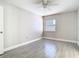 Cozy bedroom features tile flooring, neutral paint, and a window at 11364 Cardiff Dr, Orlando, FL 32837