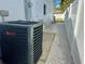 Air conditioning unit and white gravel along the side of the house at 11364 Cardiff Dr, Orlando, FL 32837