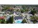 Birds eye view of a home's kidney-shaped pool with gray patio and fenced yard at 11364 Cardiff Dr, Orlando, FL 32837