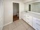 Modern bathroom featuring a vanity, walk-in closet, and new countertop at 1155 Galahad Dr, Casselberry, FL 32707