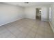 Neutral bedroom features tile flooring, natural light and a standard ceiling light at 1155 Galahad Dr, Casselberry, FL 32707