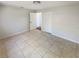 Neutral bedroom with tile flooring, closet, and white walls at 1155 Galahad Dr, Casselberry, FL 32707