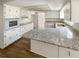 Bright kitchen with white cabinets, modern appliances, and new countertops at 1155 Galahad Dr, Casselberry, FL 32707