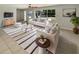 Bright living room featuring white sofas, striped rug, and ample natural light from a large window at 1155 Galahad Dr, Casselberry, FL 32707
