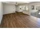 Open-concept living space with laminate flooring, connecting the kitchen and the living area at 1155 Galahad Dr, Casselberry, FL 32707