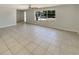 Spacious living area featuring tile floors and a large window bringing in lots of natural light at 1155 Galahad Dr, Casselberry, FL 32707
