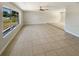 Spacious living room featuring neutral walls, recessed lighting and tile flooring throughout at 1155 Galahad Dr, Casselberry, FL 32707