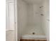 All white standing shower with a shower head, faucet, and a small soap holder at 1155 Galahad Dr, Casselberry, FL 32707