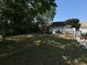 Wide backyard with large mature tree, perfect for entertaining or relaxing in the outdoors at 1233 Hancock Cir, St Cloud, FL 34769