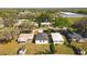 Wide angle aerial view of a single Gathering house in a residential neighborhood at 13820 Adams St, Grand Island, FL 32735