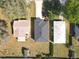 Birds eye view of a home surrounded by grass and other properties at 13820 Adams St, Grand Island, FL 32735