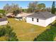 Aerial view of the backyard and surrounding neighborhood at 13820 Adams St, Grand Island, FL 32735