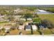High aerial view of a home in a residential area near green space at 13820 Adams St, Grand Island, FL 32735