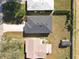 Birds eye view of a home showing roof and surrounding properties at 13820 Adams St, Grand Island, FL 32735