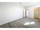 Bedroom featuring modern wood-look floors and a walk-in closet at 13820 Adams St, Grand Island, FL 32735