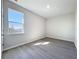 Bedroom featuring wood-look floors and a view of the neighborhood at 13820 Adams St, Grand Island, FL 32735