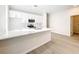 Modern kitchen featuring white cabinets, stylish countertops, and stainless steel appliances at 13820 Adams St, Grand Island, FL 32735
