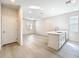 Open kitchen area with a central island featuring a sink and faucet at 13820 Adams St, Grand Island, FL 32735