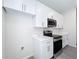 Kitchen featuring marble countertops and stainless steel microwave and oven at 13820 Adams St, Grand Island, FL 32735