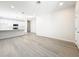 Open-concept living room featuring sleek floors, recessed lighting, and ample space at 13820 Adams St, Grand Island, FL 32735