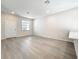 Spacious living room featuring stylish flooring, recessed lighting, and ample natural light at 13820 Adams St, Grand Island, FL 32735