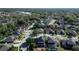 Aerial view of the homes in the community showcase mature trees and landscaping, including the pool in the distance at 1421 Arbitus Cir, Oviedo, FL 32765