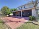 The screened-in patio overlooks a spacious backyard with a brick-paved patio area at 1421 Arbitus Cir, Oviedo, FL 32765