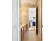 Neutral bathroom featuring a double sink vanity and view into the adjacent bedroom at 1421 Arbitus Cir, Oviedo, FL 32765