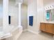 Bright bathroom with a soaking tub, columns, vanity, mirror, towel bar, and tile flooring at 1421 Arbitus Cir, Oviedo, FL 32765