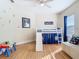 Bright bedroom featuring a loft bed with a slide, natural light, and neutral decor at 1421 Arbitus Cir, Oviedo, FL 32765