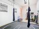 Finished garage featuring workout equipment, aerial silks, and wrestling mats at 1421 Arbitus Cir, Oviedo, FL 32765