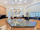 Close up on kitchen island featuring a dark countertop and plenty of storage underneath at 1421 Arbitus Cir, Oviedo, FL 32765