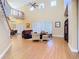 Open concept living room with high ceilings, lots of windows, and wood floors at 1421 Arbitus Cir, Oviedo, FL 32765