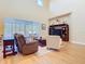 Open concept living room with high ceilings, lots of windows, and wood floors at 1421 Arbitus Cir, Oviedo, FL 32765